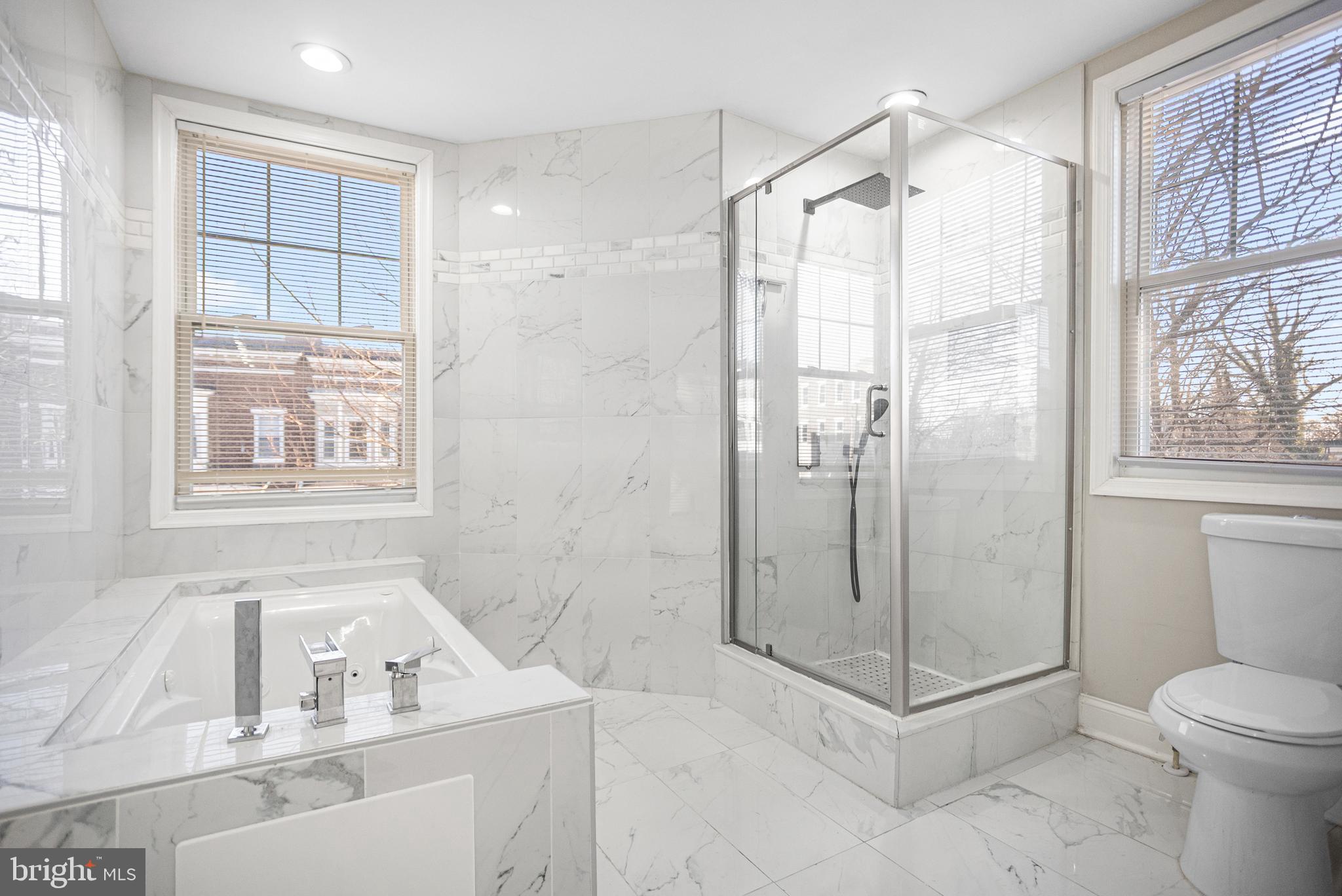 3200 Chelsea Terrace Baltimore, MD 21216 - Photo 19 of 48 a bathroom with a shower sink and mirror