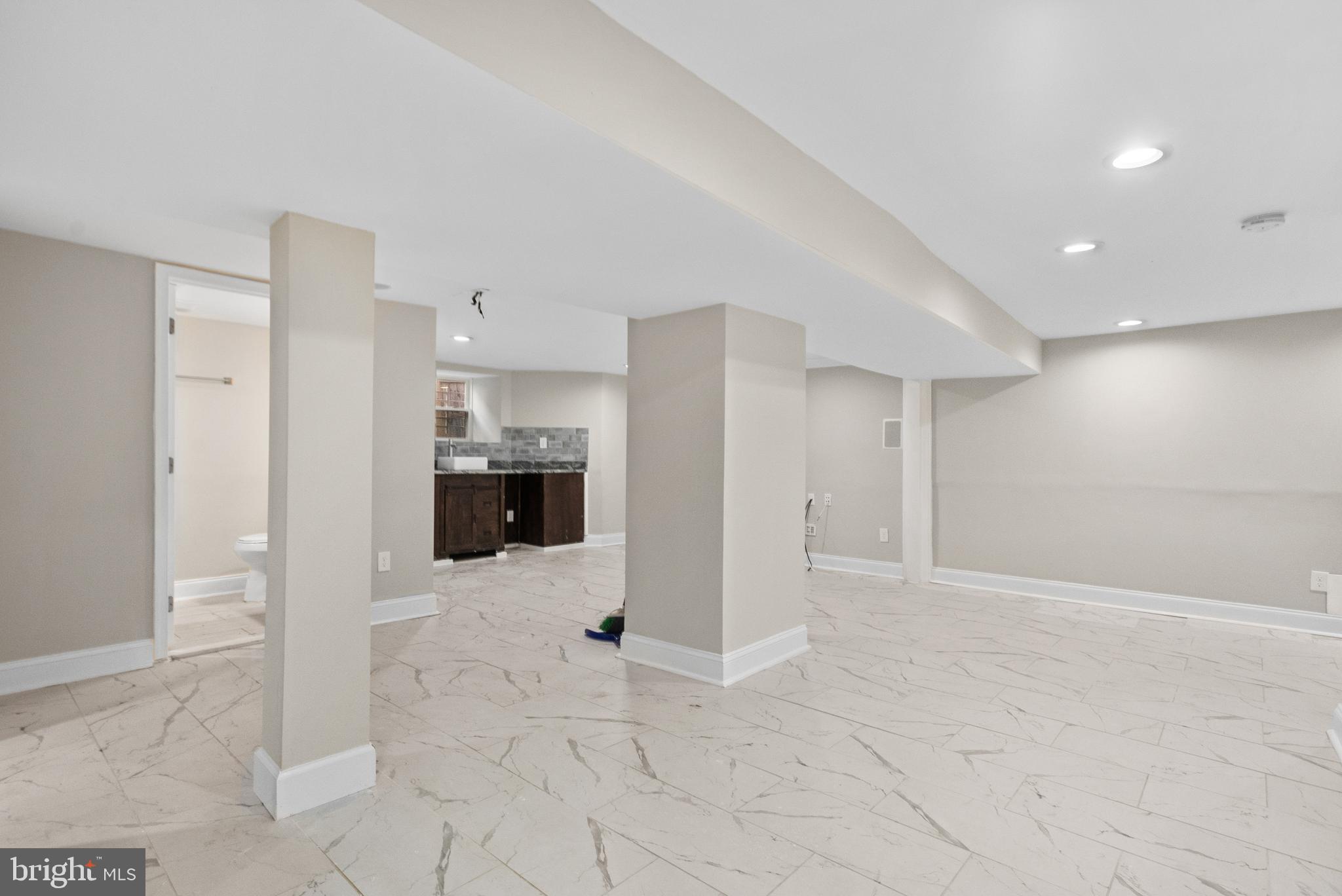 3200 Chelsea Terrace Baltimore, MD 21216 - Photo 41 of 48 a view of a hallway with wooden floor and a living room