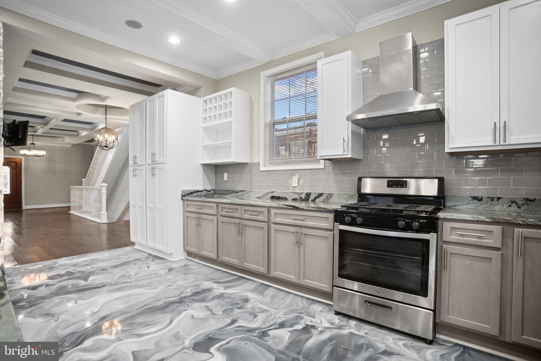 3200 Chelsea Terrace Baltimore, MD 21216 - Photo 10 of 48 a kitchen with stainless steel appliances granite countertop a stove and a sink