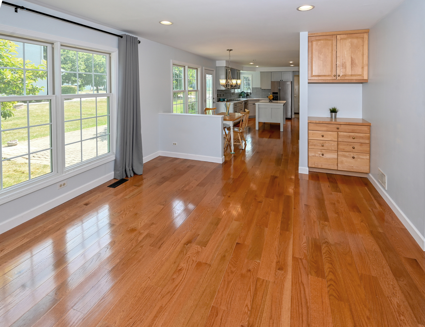 413 Rugby Place Schaumburg, IL 60169 - Photo 11 of 30 a living room with furniture and a wooden floor