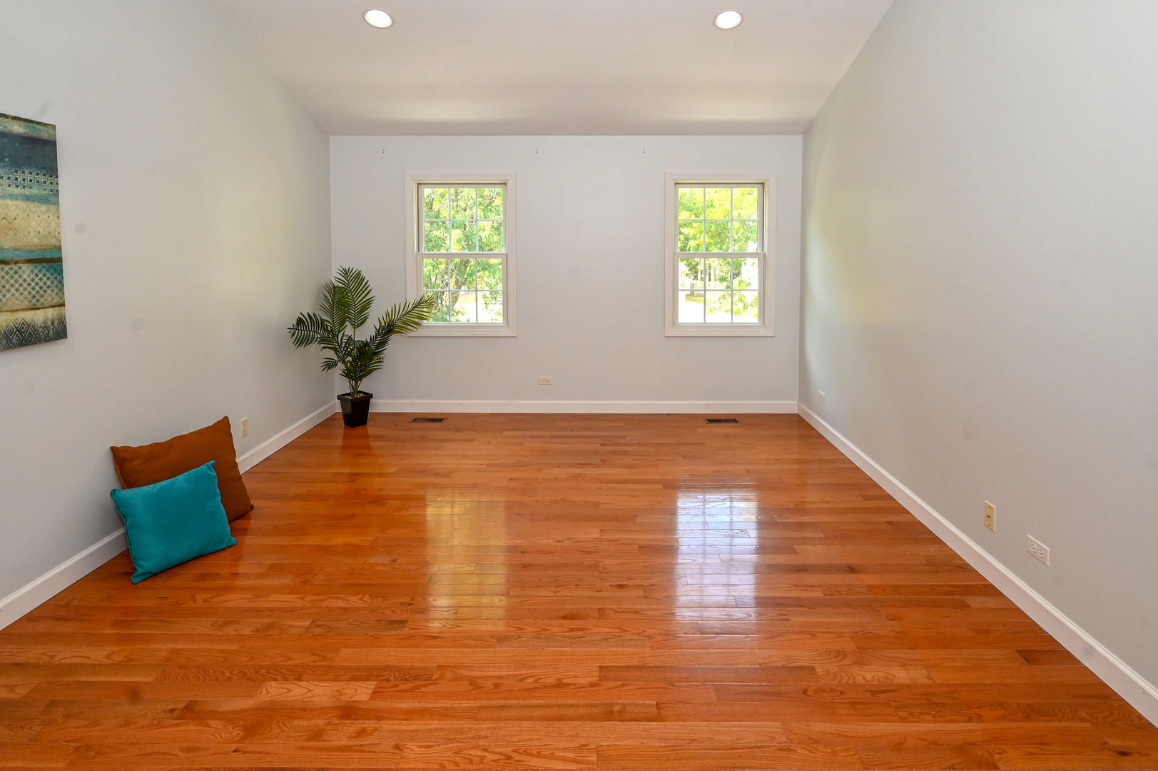 413 Rugby Place Schaumburg, IL 60169 - Photo 17 of 30 a view of room with window and wooden floor