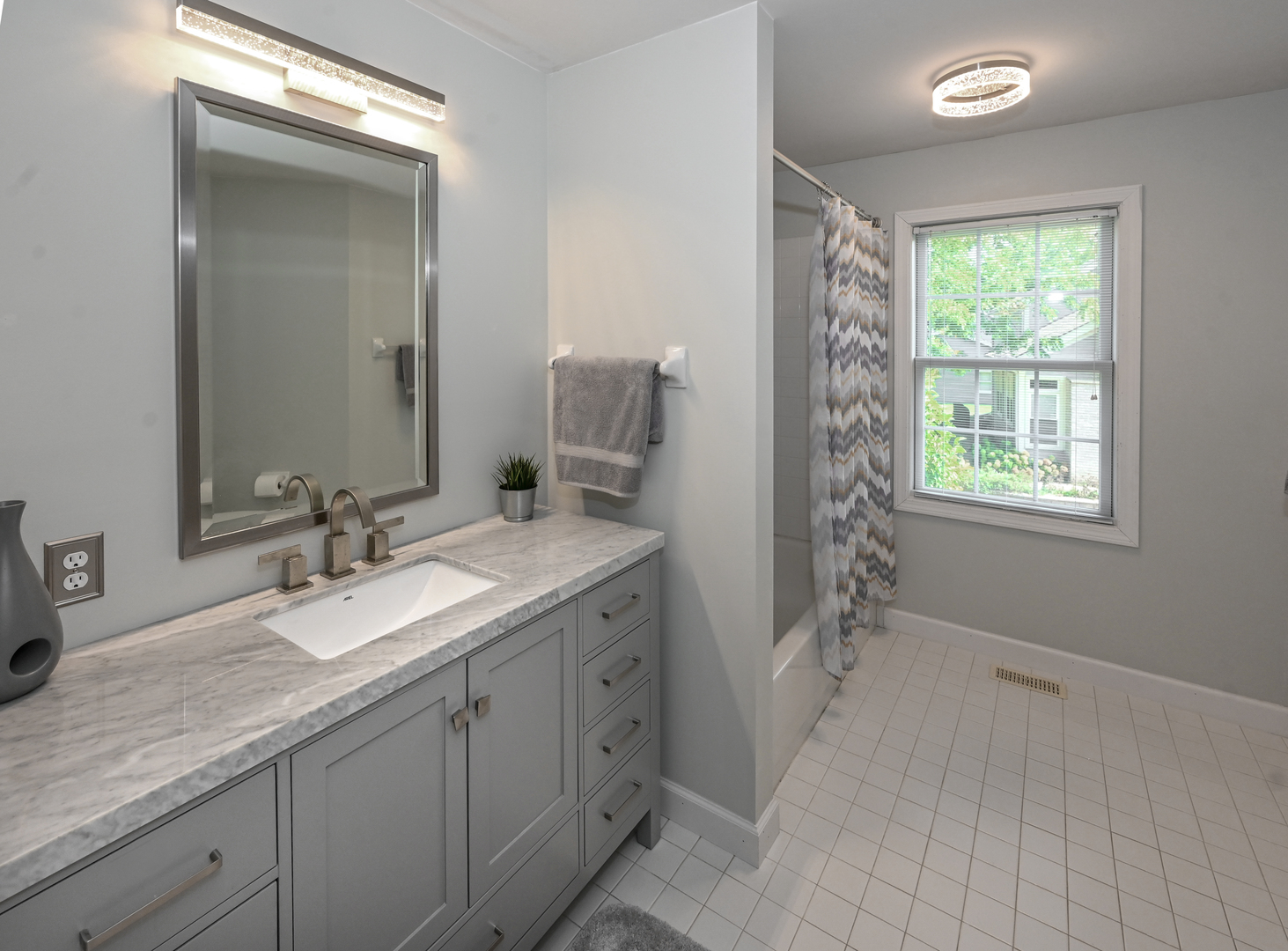 413 Rugby Place Schaumburg, IL 60169 - Photo 24 of 30 a bathroom with double vanity and a mirror