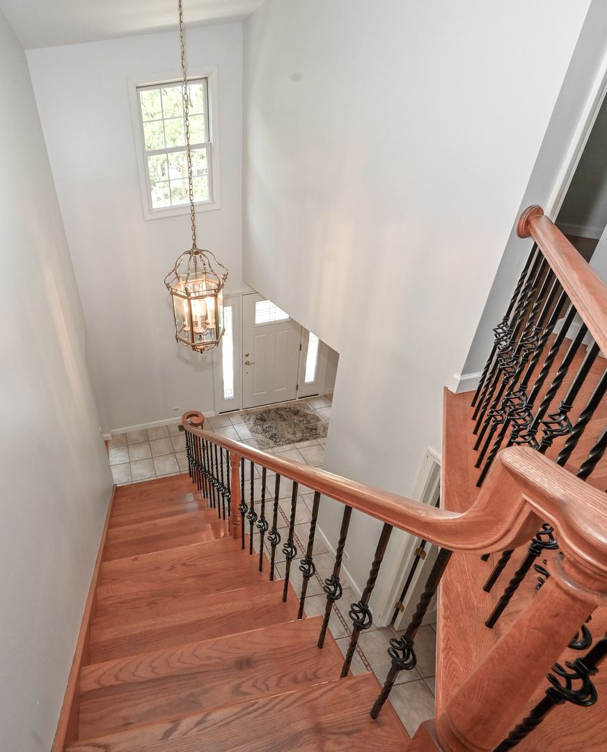 413 Rugby Place Schaumburg, IL 60169 - Photo 25 of 30 a view of entryway and hall with wooden floor