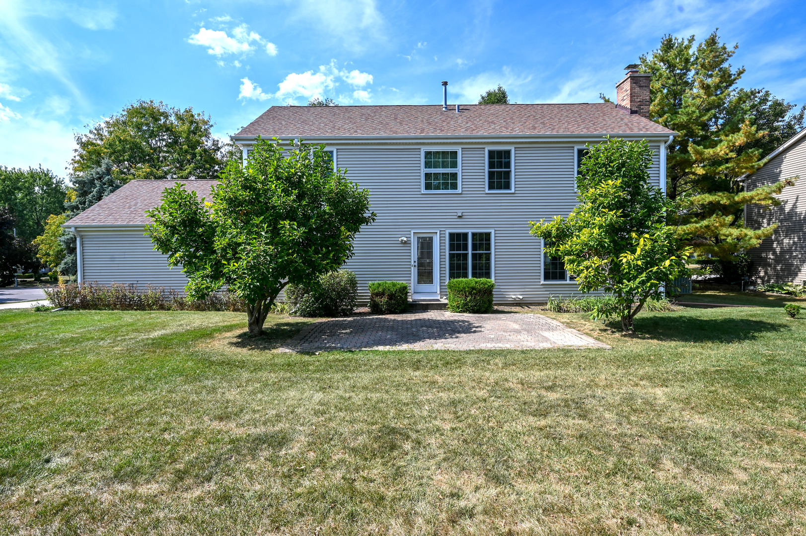 413 Rugby Place Schaumburg, IL 60169 - Photo 29 of 30 a view of a house with a yard and a garden