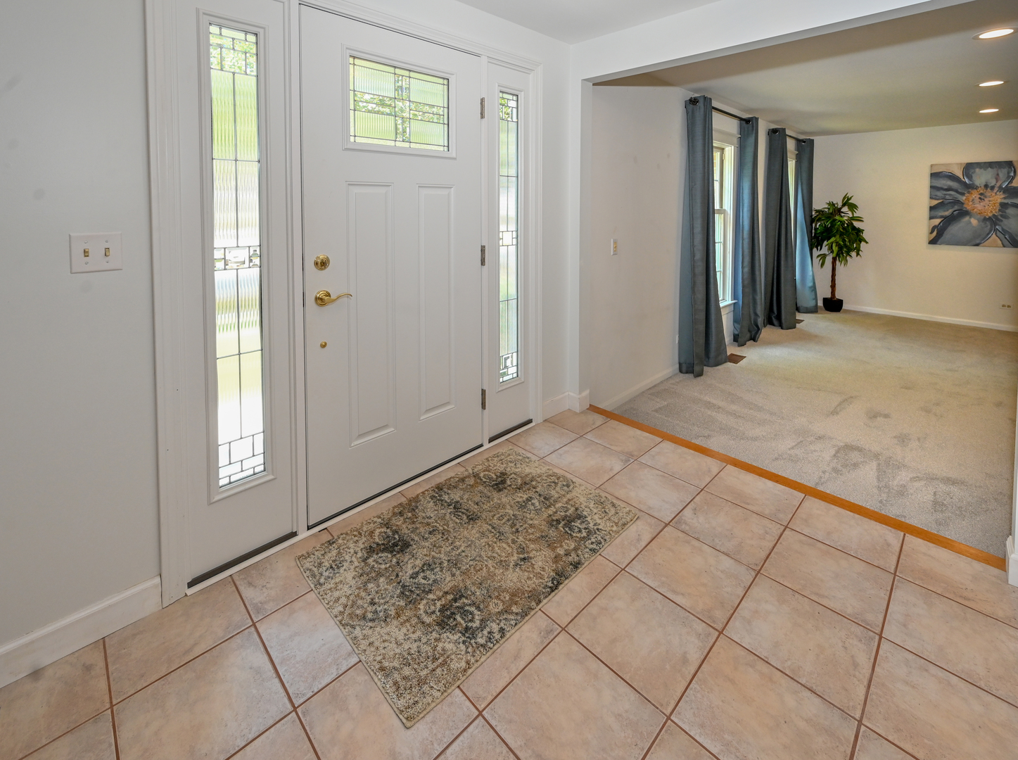 413 Rugby Place Schaumburg, IL 60169 - Photo 3 of 30 a view of hallway with window and stairs