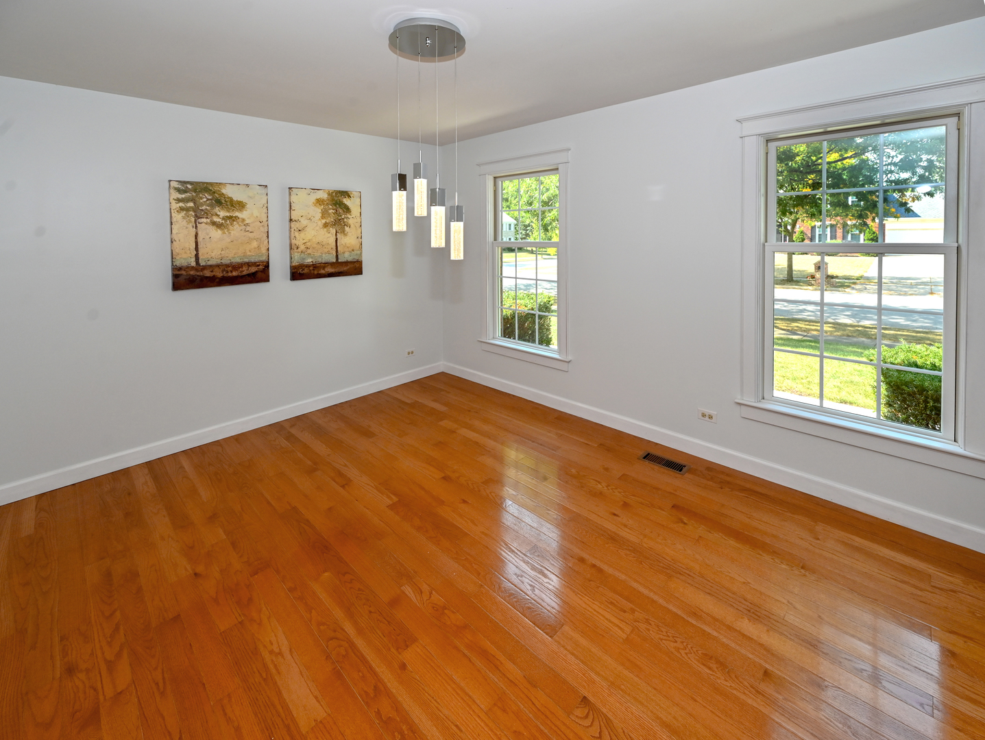 413 Rugby Place Schaumburg, IL 60169 - Photo 7 of 30 a view of an empty room with windows