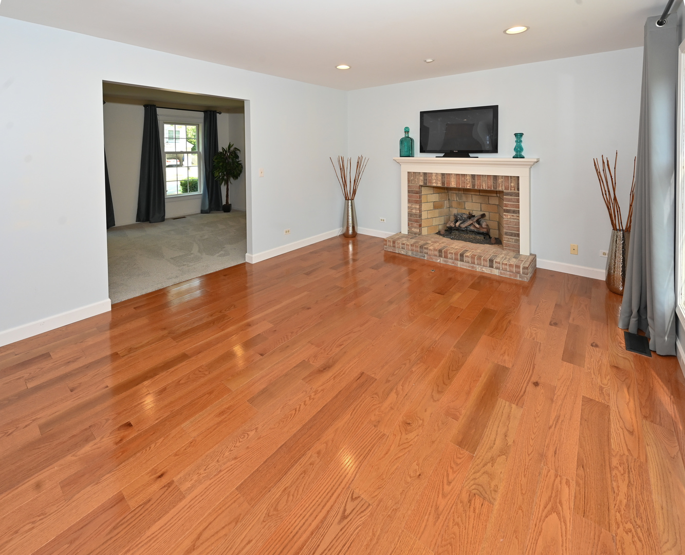 413 Rugby Place Schaumburg, IL 60169 - Photo 10 of 30 a living room with furniture and a flat screen tv