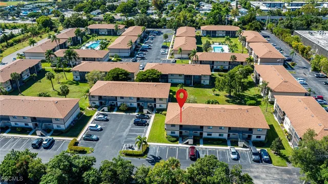 an aerial view of house with swimming pool outdoor seating and yard