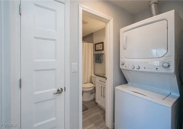 a view of bathroom with a washer and dryer