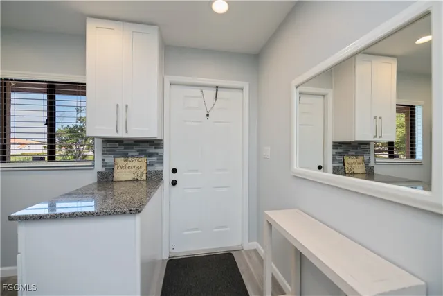 a kitchen with a sink stove and cabinets
