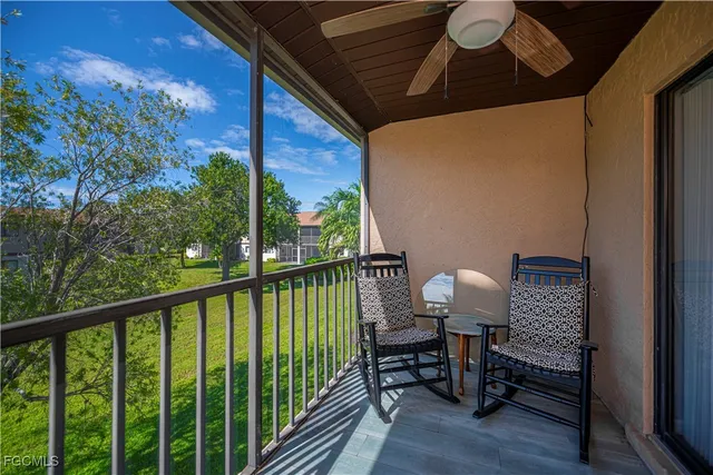 a view of a chair and table in the balcony