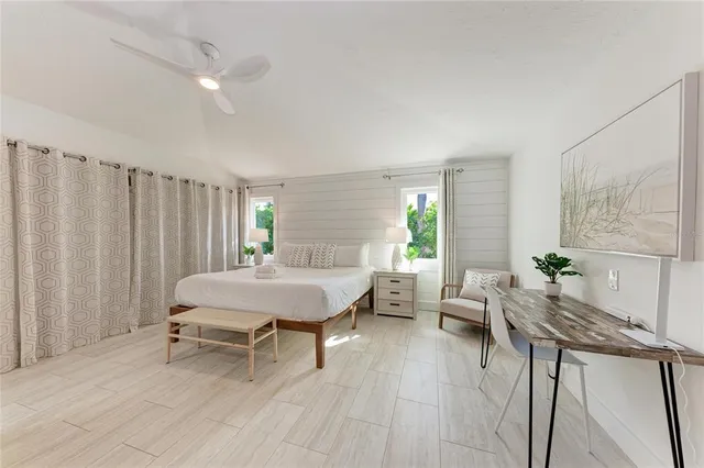 a bedroom with a bed and cabinets