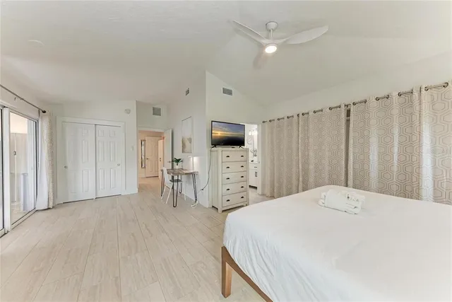 a bedroom with a bed and a table