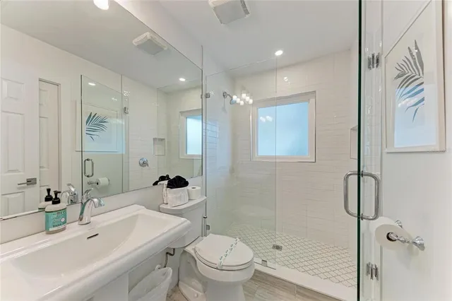a dining room with furniture and a flat screen tv
