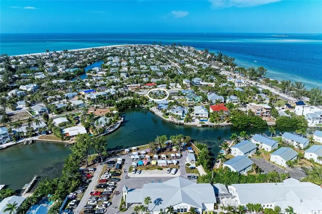 a front view of a house with a yard and a garage