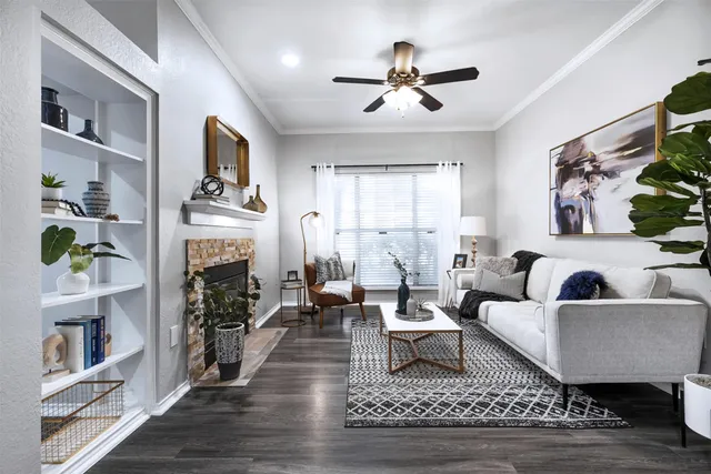 a living room with furniture and a fireplace