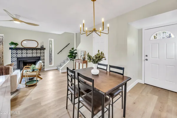 a view of a dining room with furniture and wooden floor