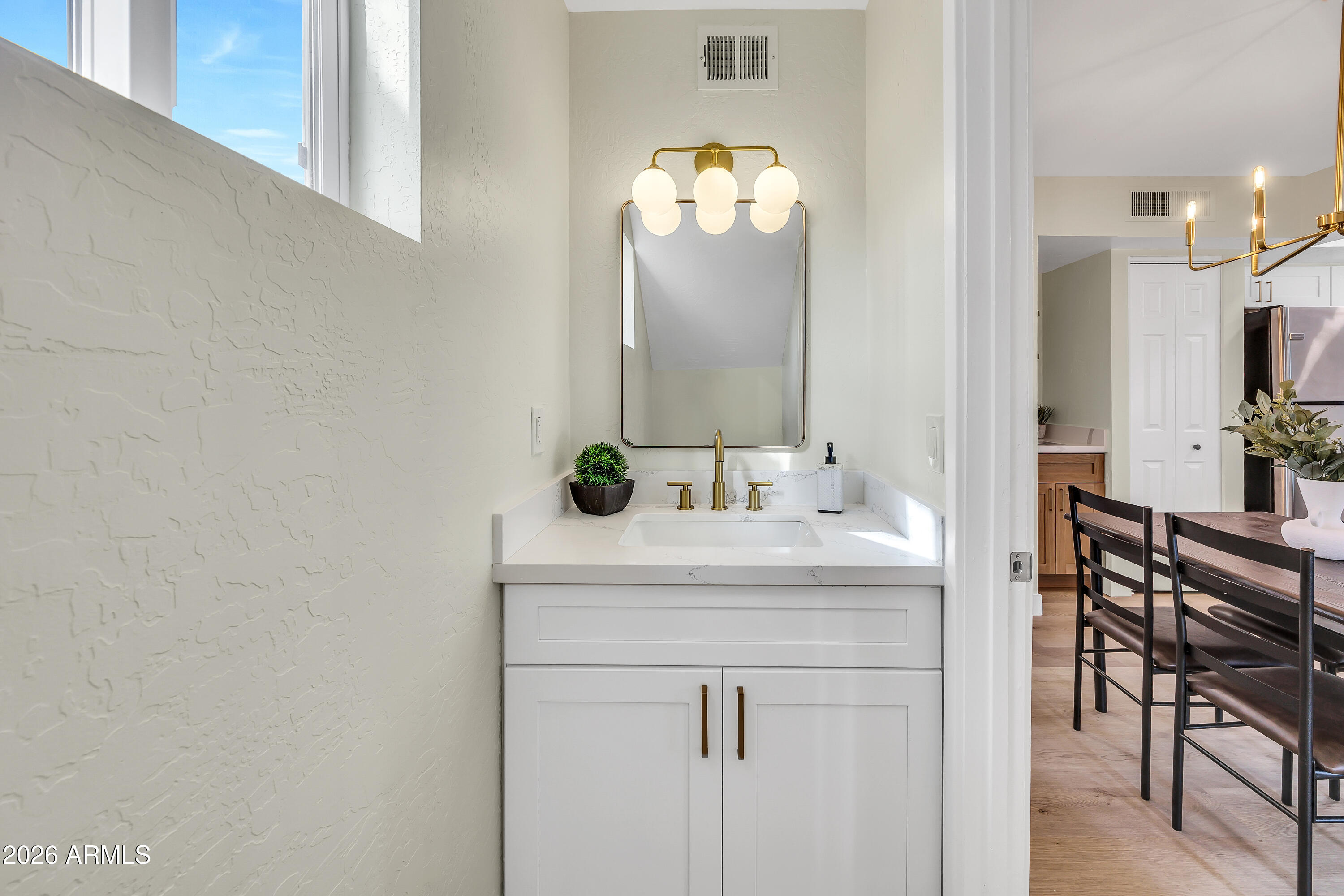 4142 North 11th Street, Unit 4 Phoenix, AZ 85014 - Photo 15 of 25 a bathroom with a sink and a mirror