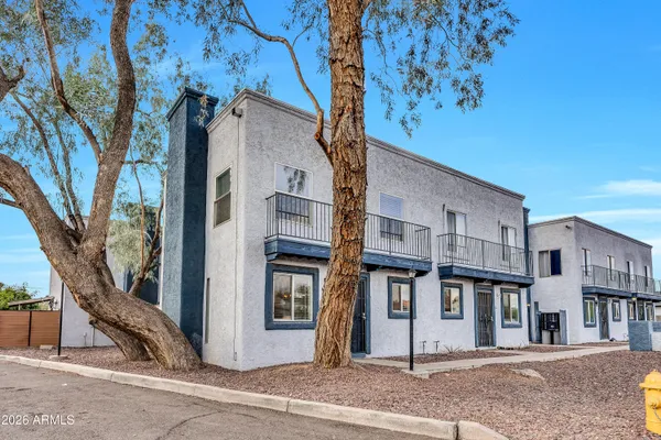 a view of a house with a street