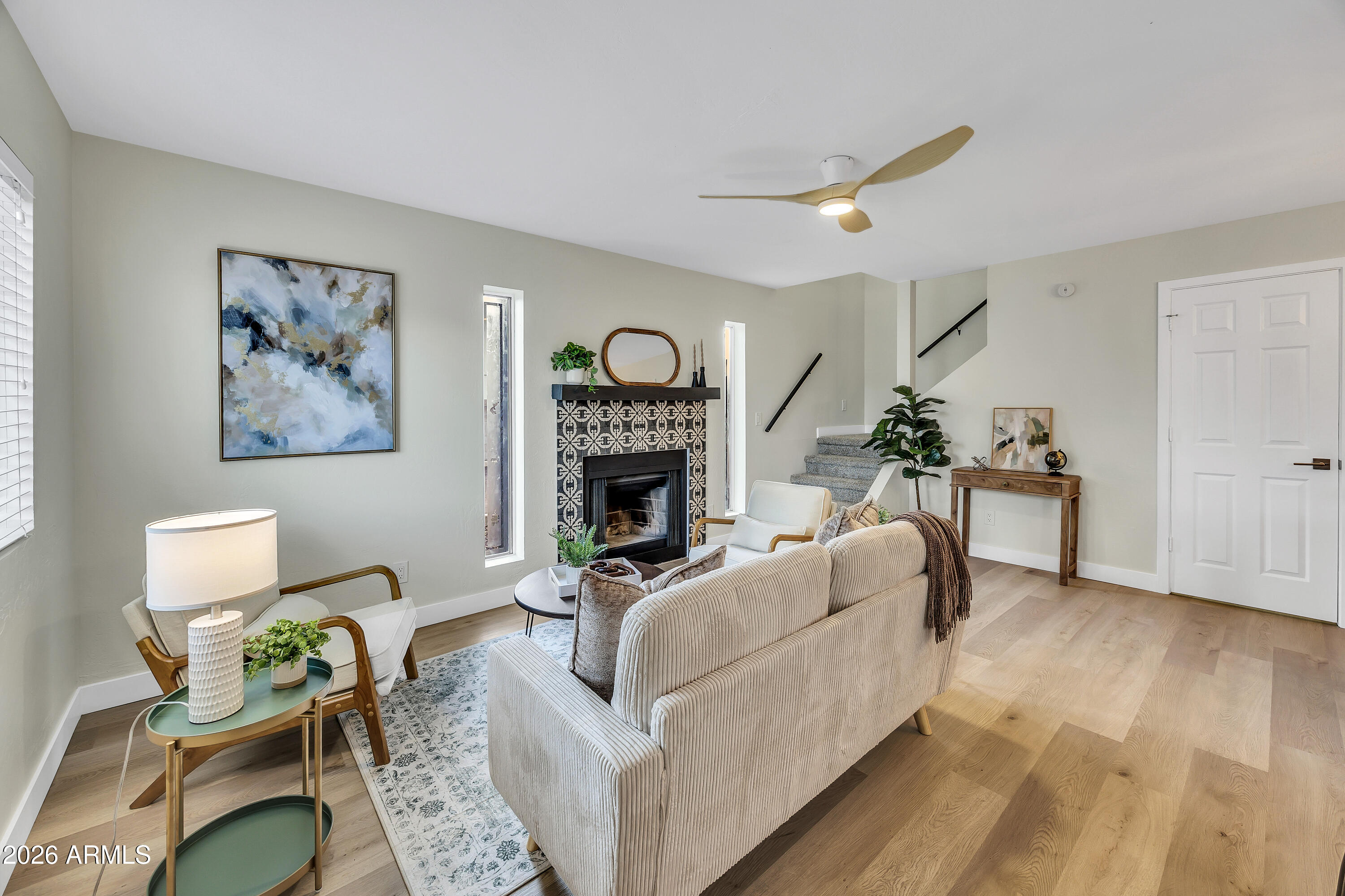 4142 North 11th Street, Unit 4 Phoenix, AZ 85014 - Photo 4 of 25 a living room with furniture and a fireplace