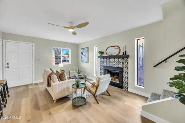 a living room with furniture and a fireplace