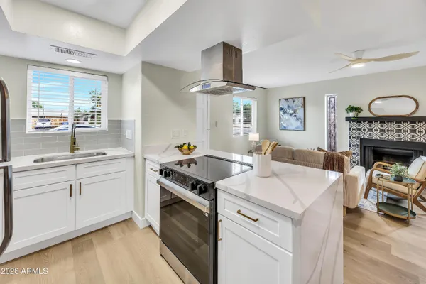 a kitchen with a stove and a sink