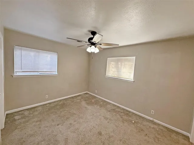 a bathroom with a sink toilet and a mirror