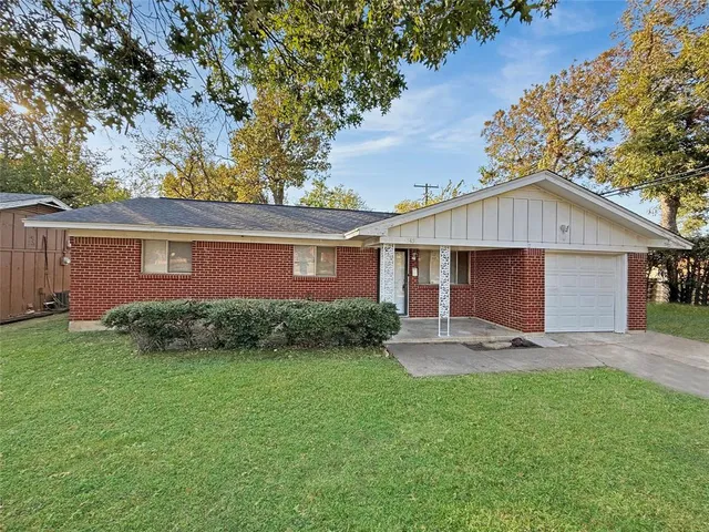 front view of a house with a yard