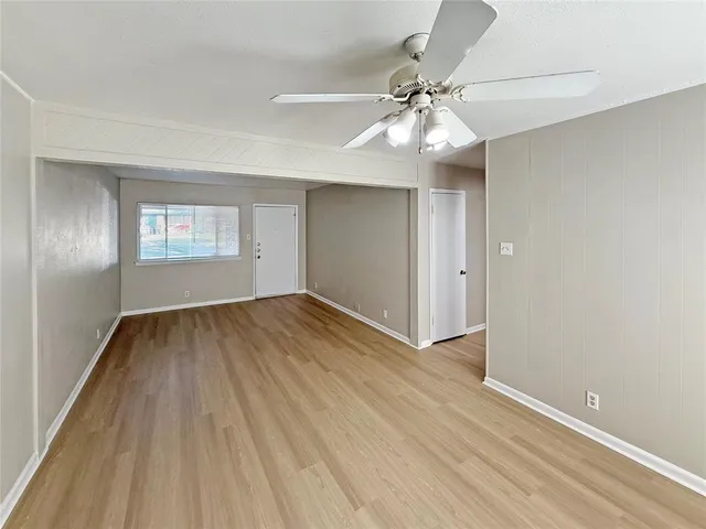 a kitchen with a white cabinets and white appliances