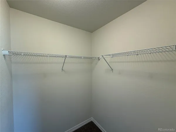 a view of a room with racks on the wall