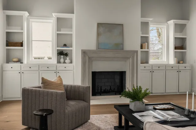 a living room with furniture and a fireplace