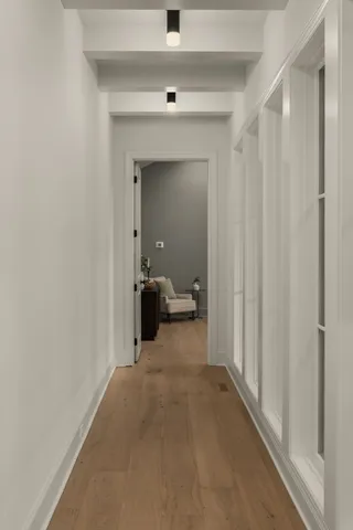 a bedroom with a bed and a mirror