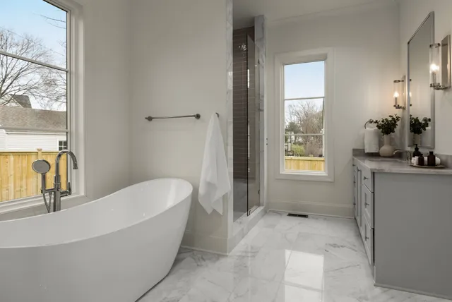 a bathroom with a bathtub and shower