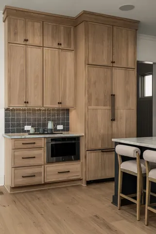 a view of kitchen with furniture and large window