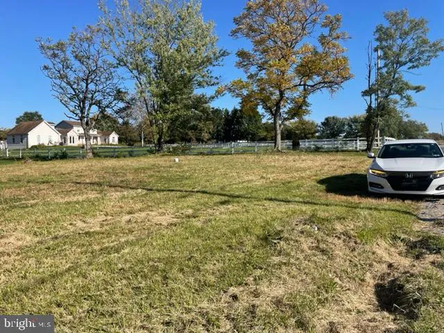 a view of a patio with a yard