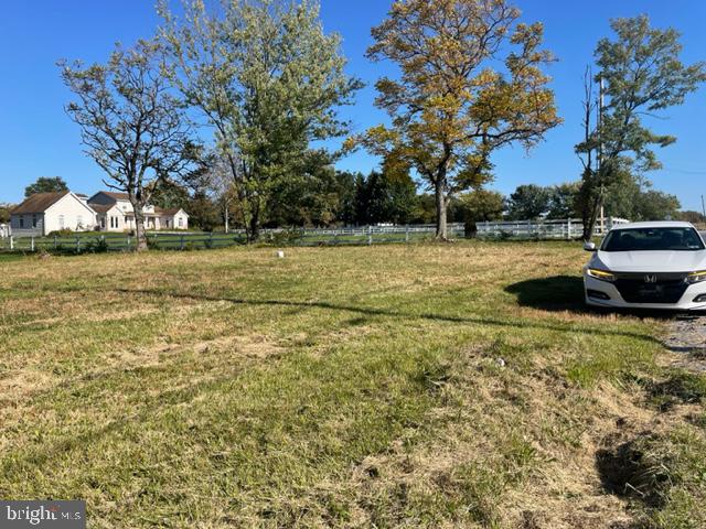 a view of a patio with a yard