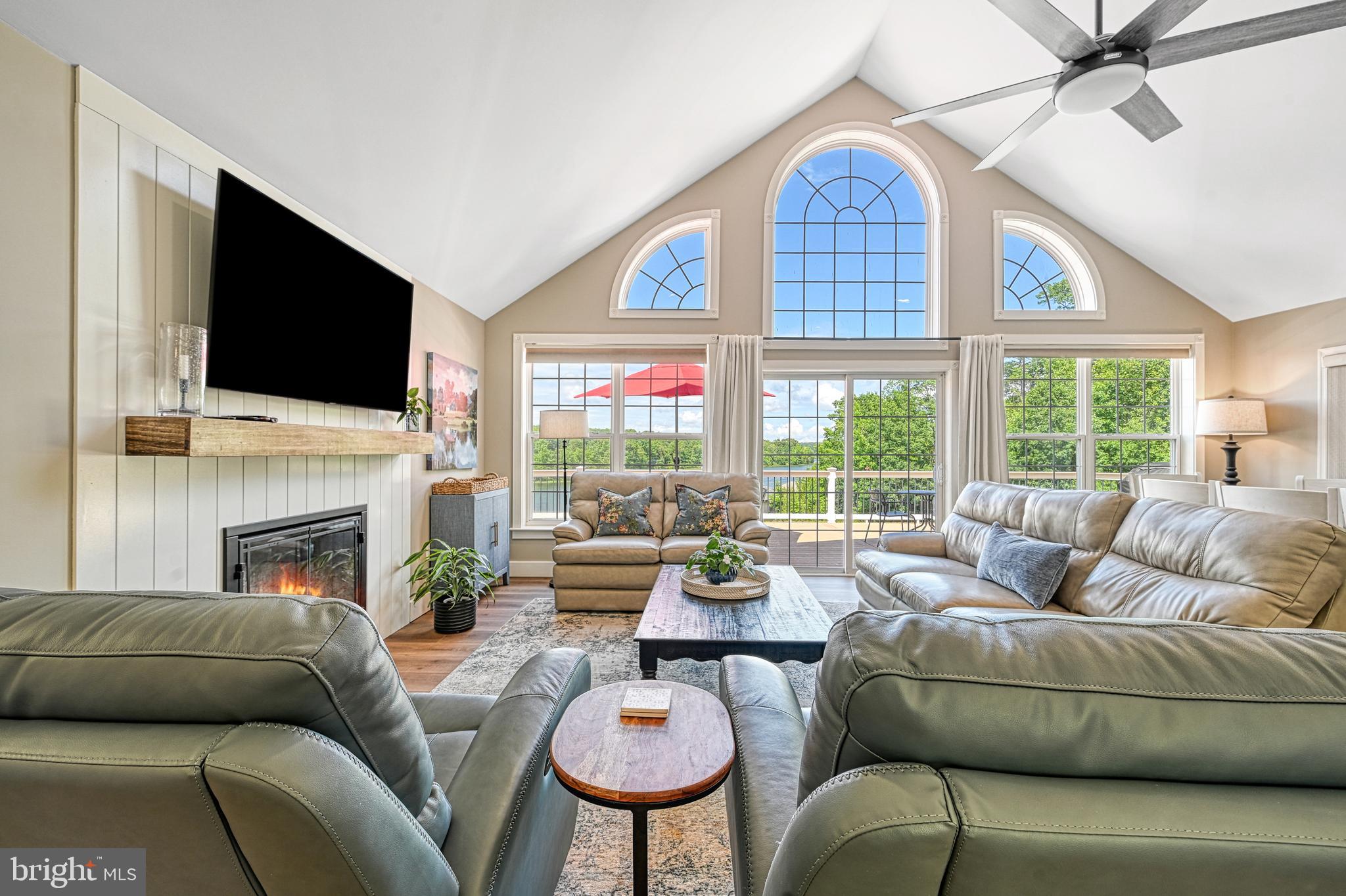 1069 Mitchell Point Road Mineral, VA 23117 - Photo 21 of 110 a living room with furniture a fireplace and a flat screen tv