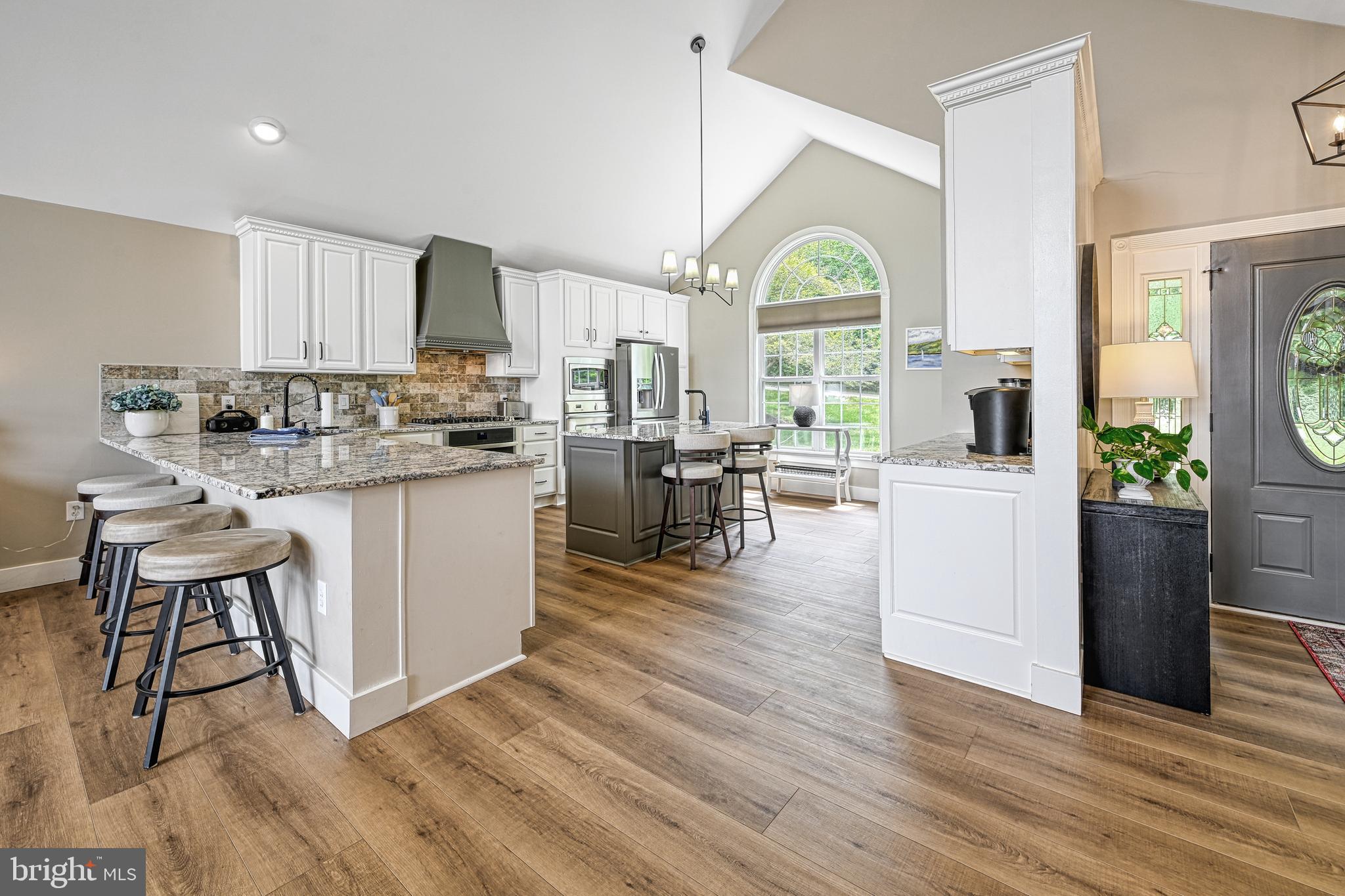 1069 Mitchell Point Road Mineral, VA 23117 - Photo 24 of 110 a living room with stainless steel appliances furniture wooden floor and a kitchen view