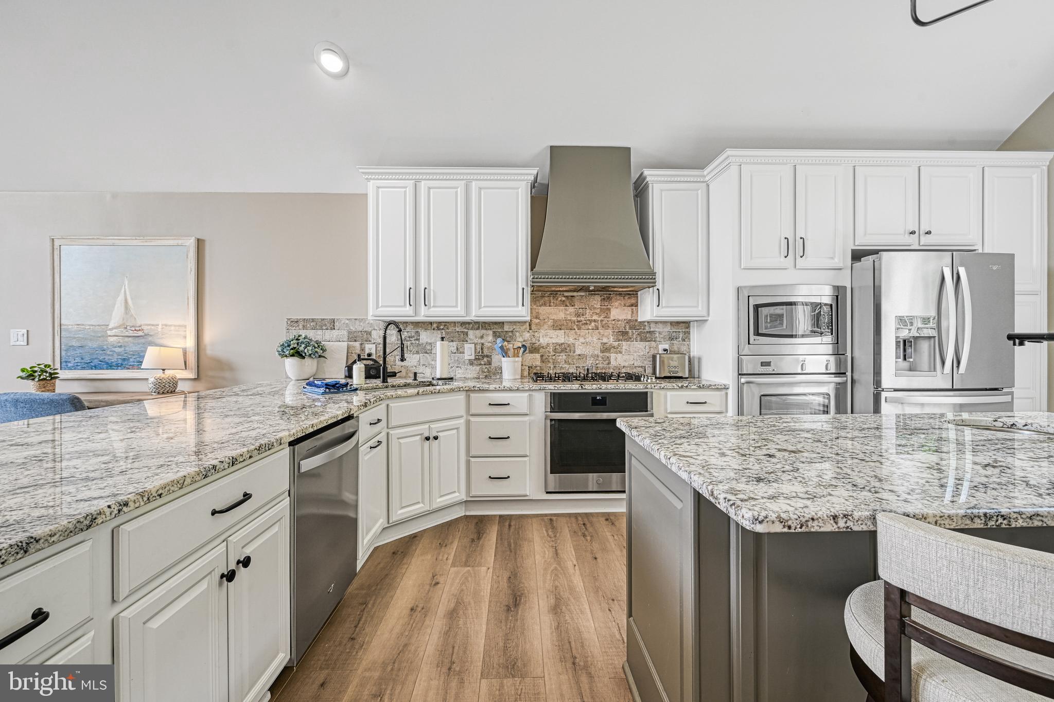 1069 Mitchell Point Road Mineral, VA 23117 - Photo 29 of 110 a kitchen with stainless steel appliances granite countertop a sink refrigerator and cabinets