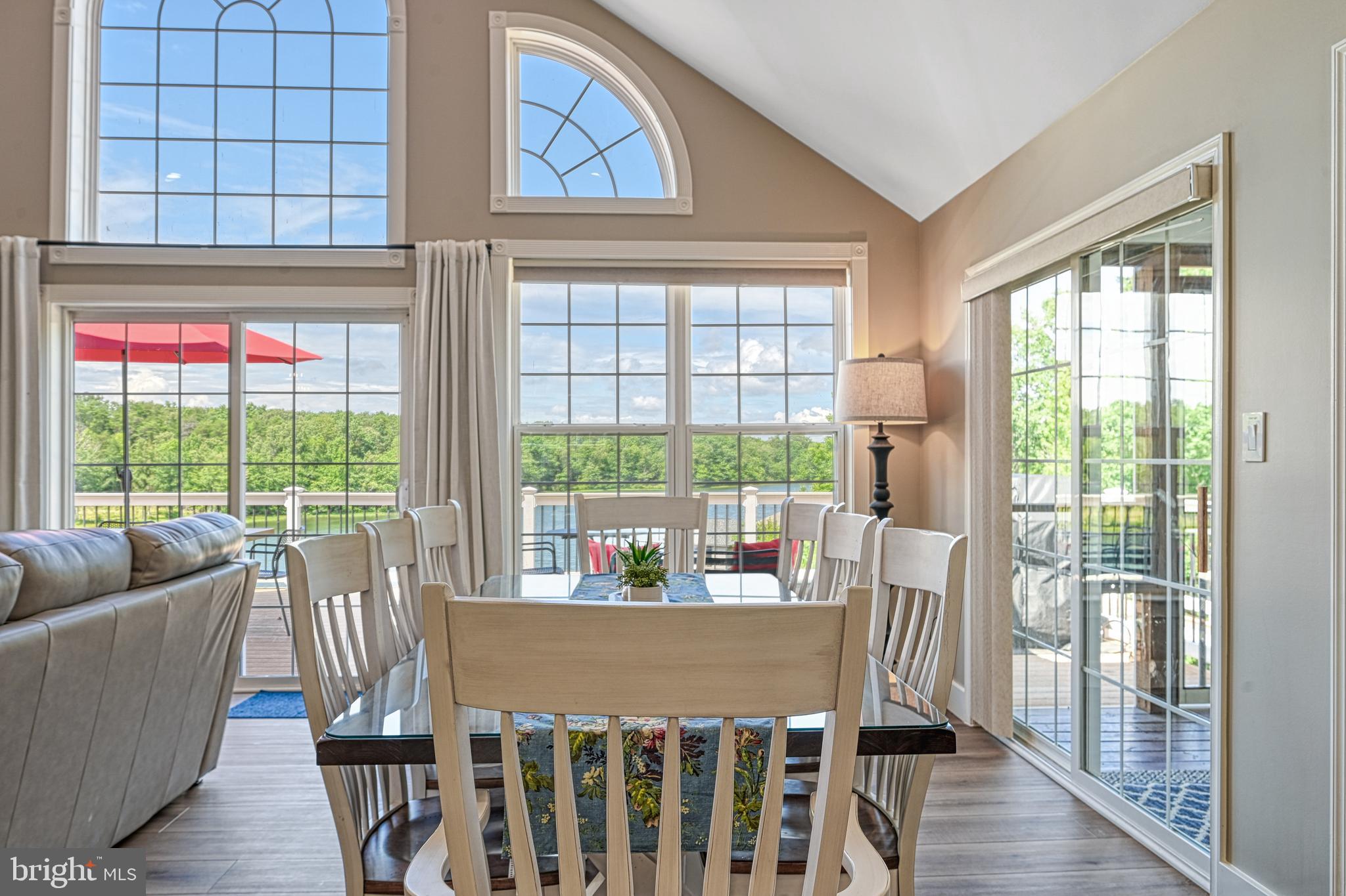 1069 Mitchell Point Road Mineral, VA 23117 - Photo 34 of 110 a view of a dining room with furniture large windows and wooden floor