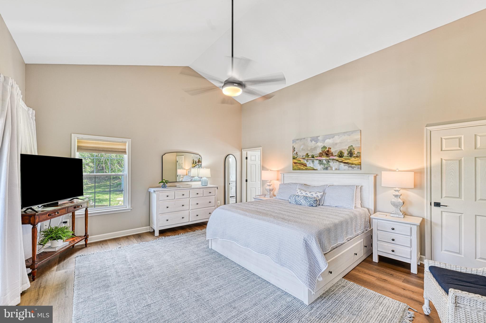 1069 Mitchell Point Road Mineral, VA 23117 - Photo 37 of 110 a bedroom with a bed and a flat tv screen on dresser