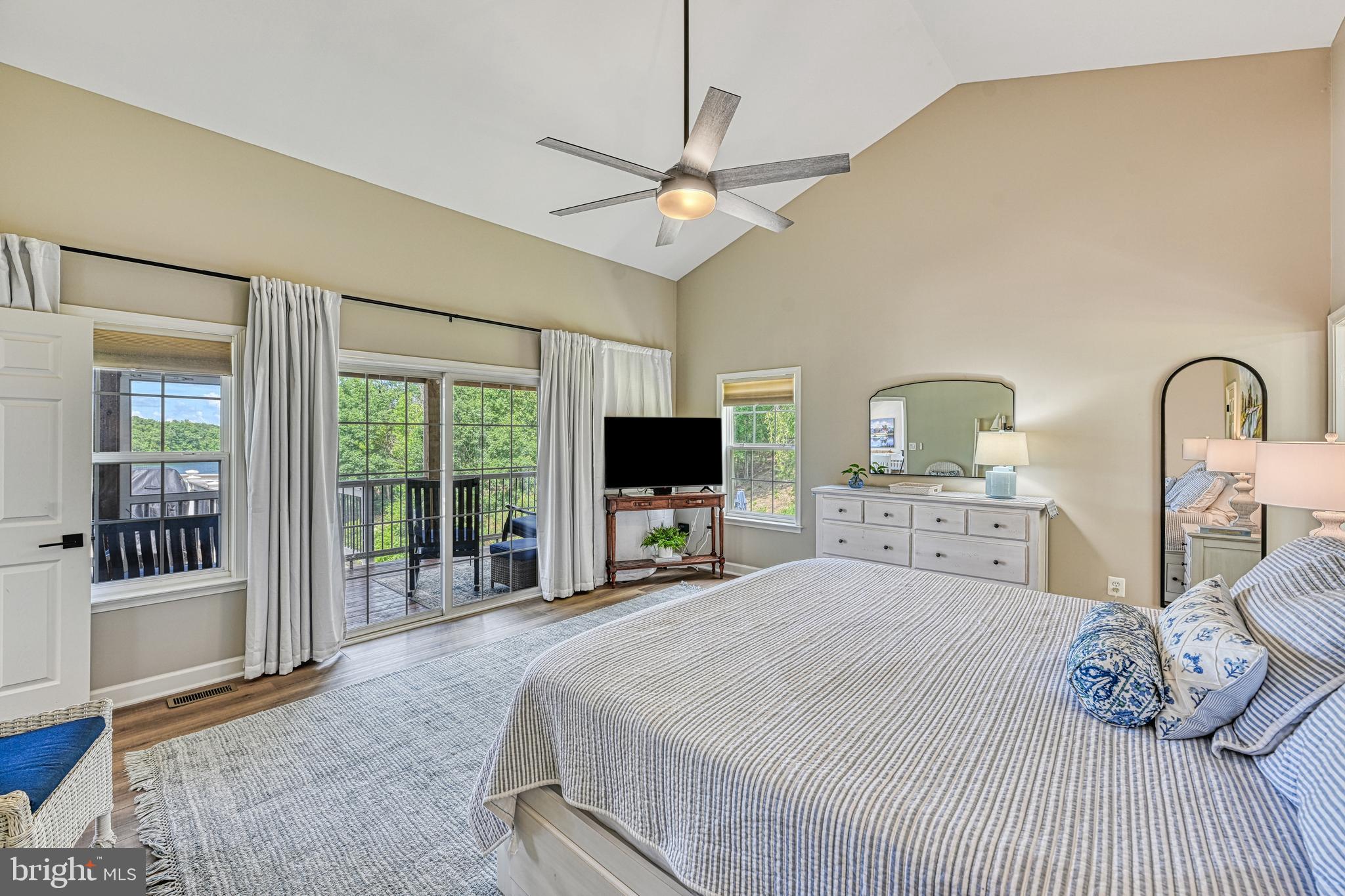 1069 Mitchell Point Road Mineral, VA 23117 - Photo 41 of 110 a bedroom with a large bed and a flat screen tv