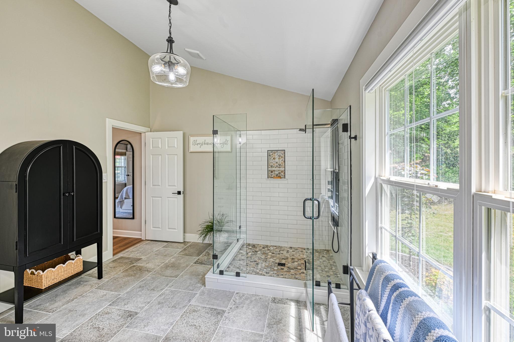 1069 Mitchell Point Road Mineral, VA 23117 - Photo 44 of 110 a spacious bedroom with a large bed and a chandelier