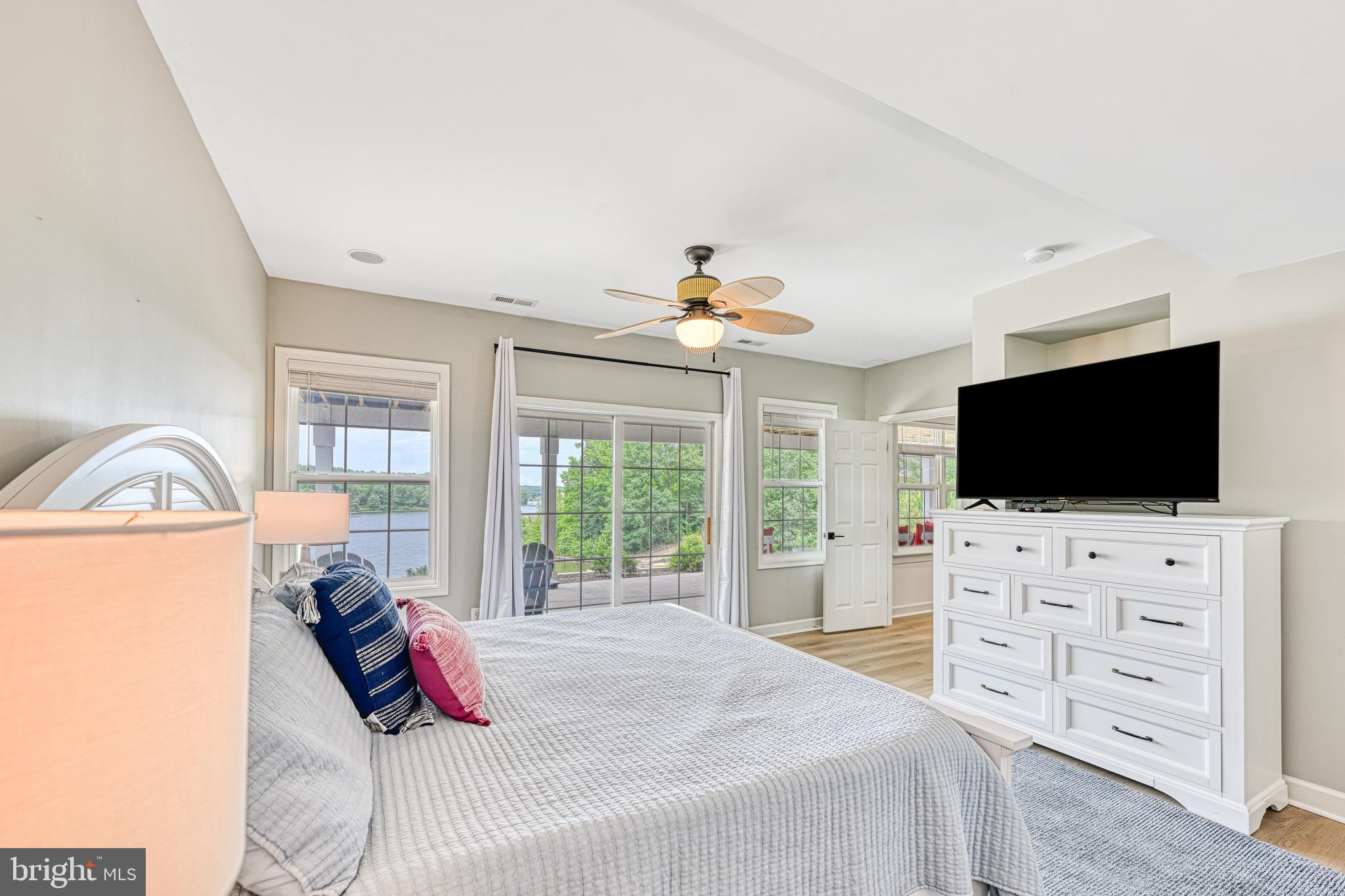 1069 Mitchell Point Road Mineral, VA 23117 - Photo 60 of 110 a bedroom with a bed and a flat tv screen on wall