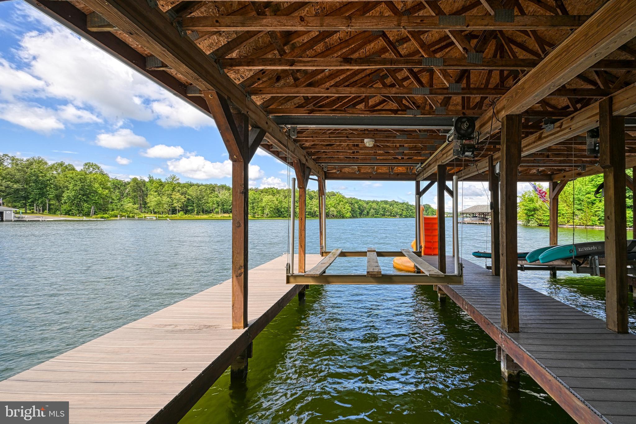 1069 Mitchell Point Road Mineral, VA 23117 - Photo 6 of 110 a view of a swimming pool with a lake from a balcony