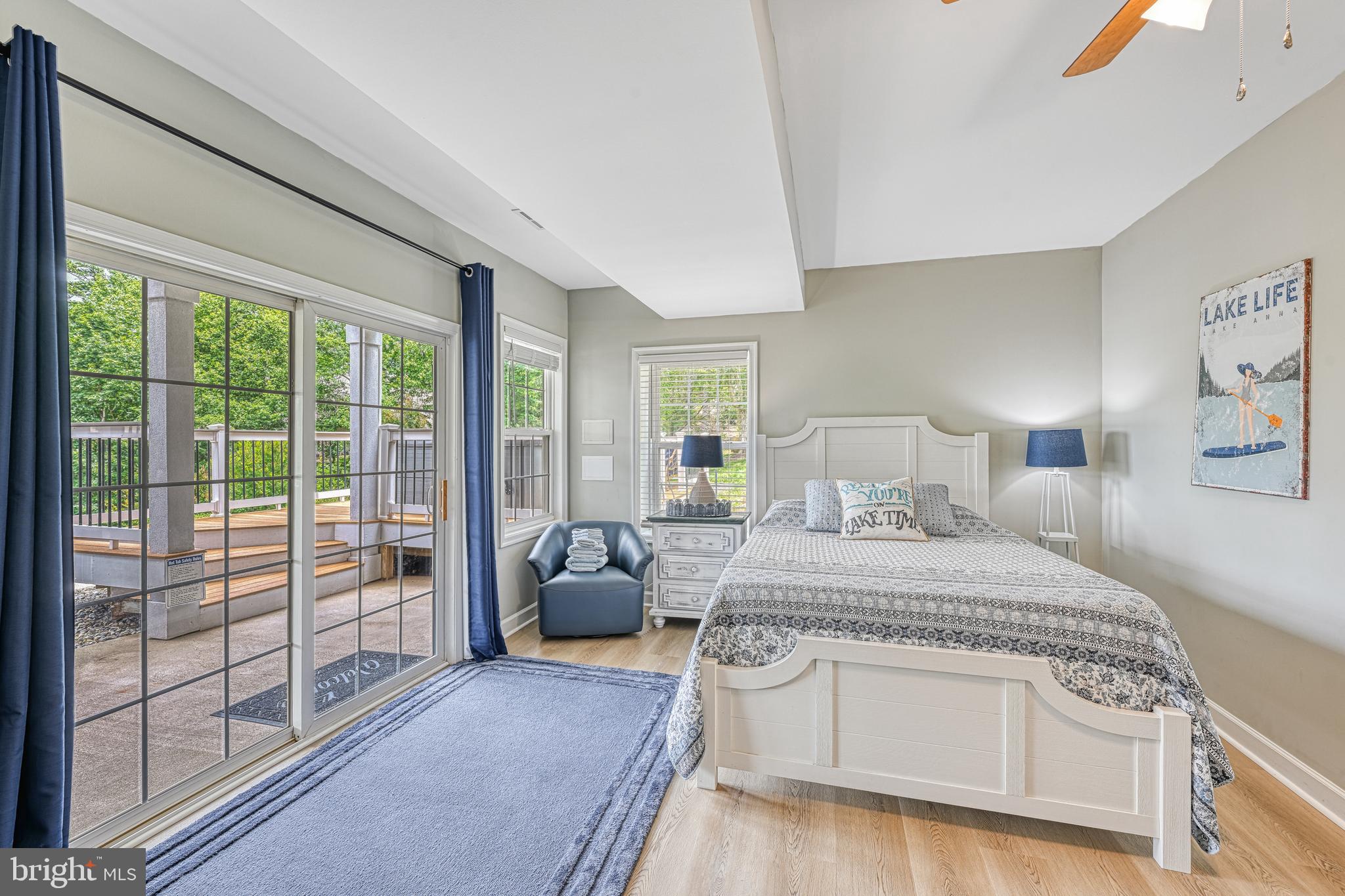 1069 Mitchell Point Road Mineral, VA 23117 - Photo 68 of 110 a bedroom with a large bed and a balcony view