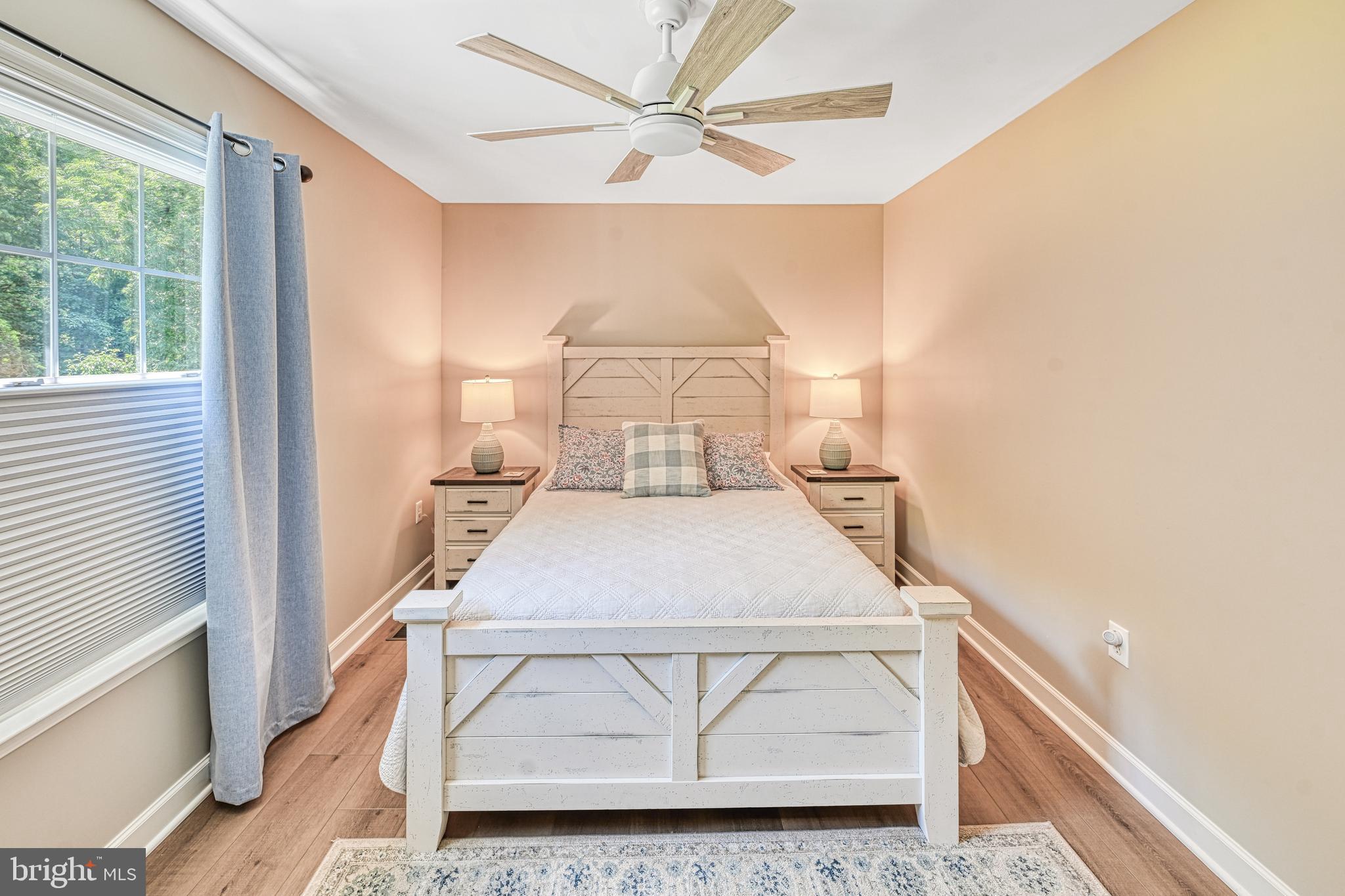 1069 Mitchell Point Road Mineral, VA 23117 - Photo 72 of 110 a bedroom with a bed and a large window with outer view