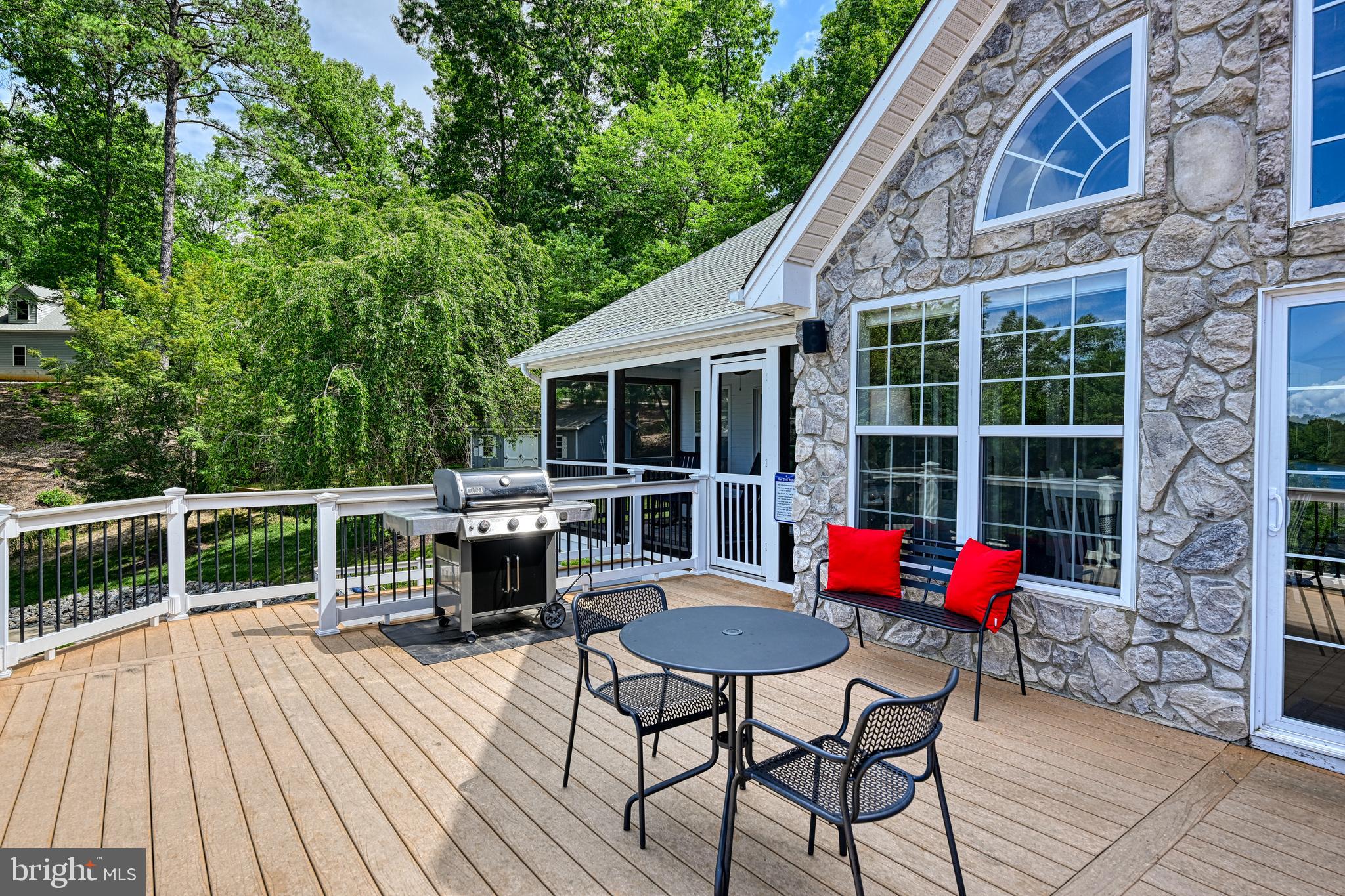 1069 Mitchell Point Road Mineral, VA 23117 - Photo 73 of 110 a balcony with wooden floor table and chairs
