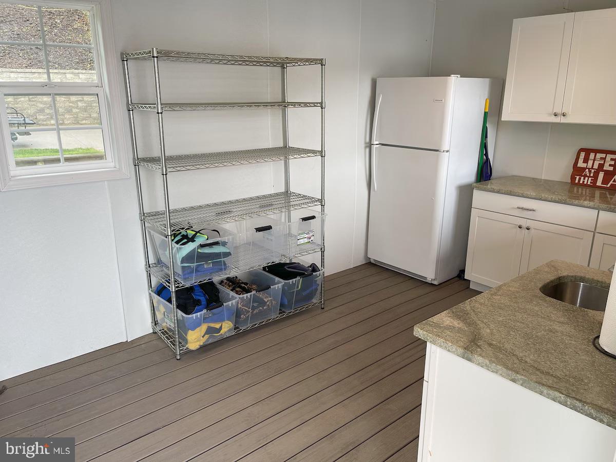 1069 Mitchell Point Road Mineral, VA 23117 - Photo 8 of 110 a kitchen with a refrigerator and a stove top oven