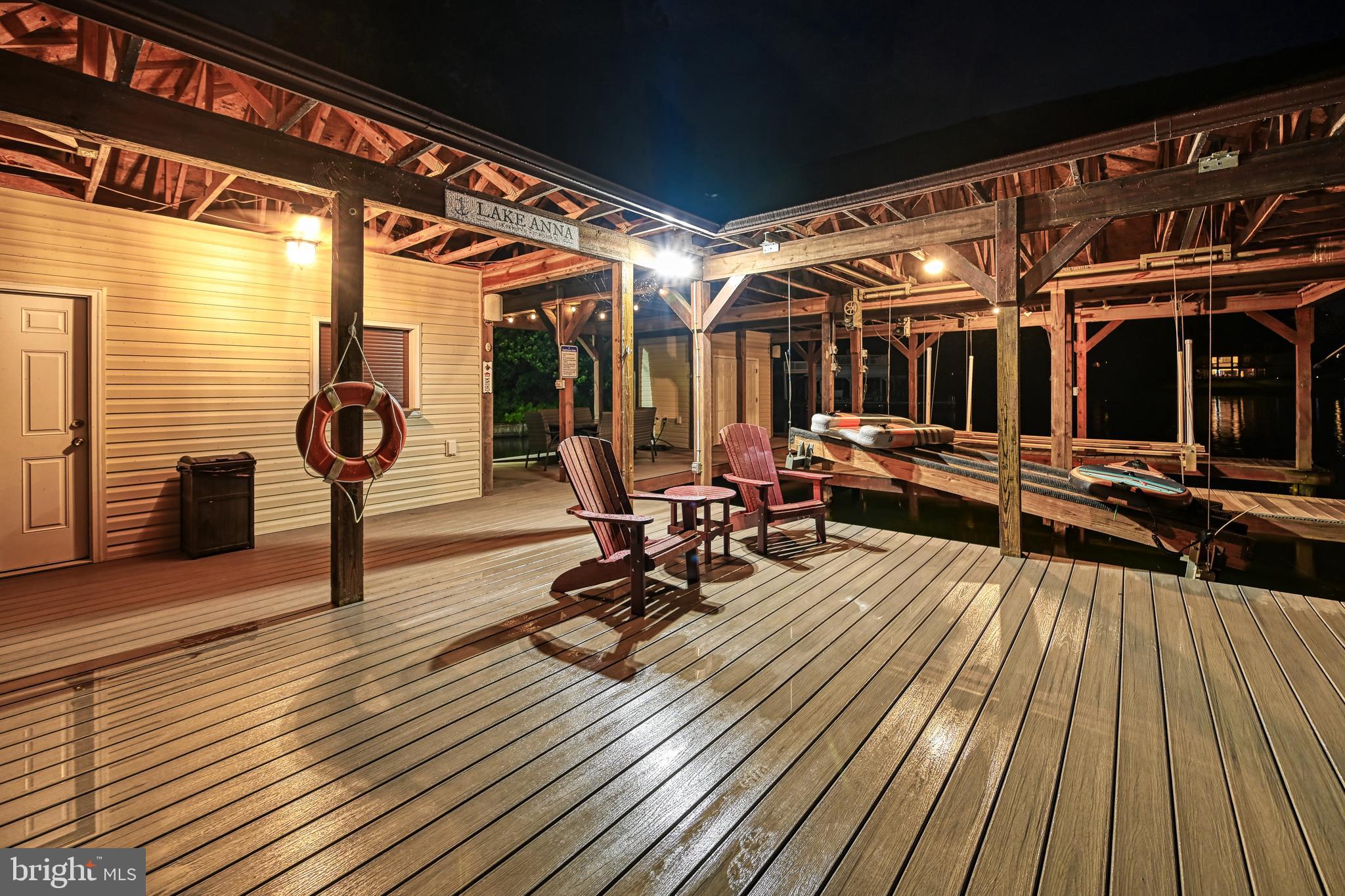 1069 Mitchell Point Road Mineral, VA 23117 - Photo 10 of 110 a view of a patio with wooden floor and outdoor seating